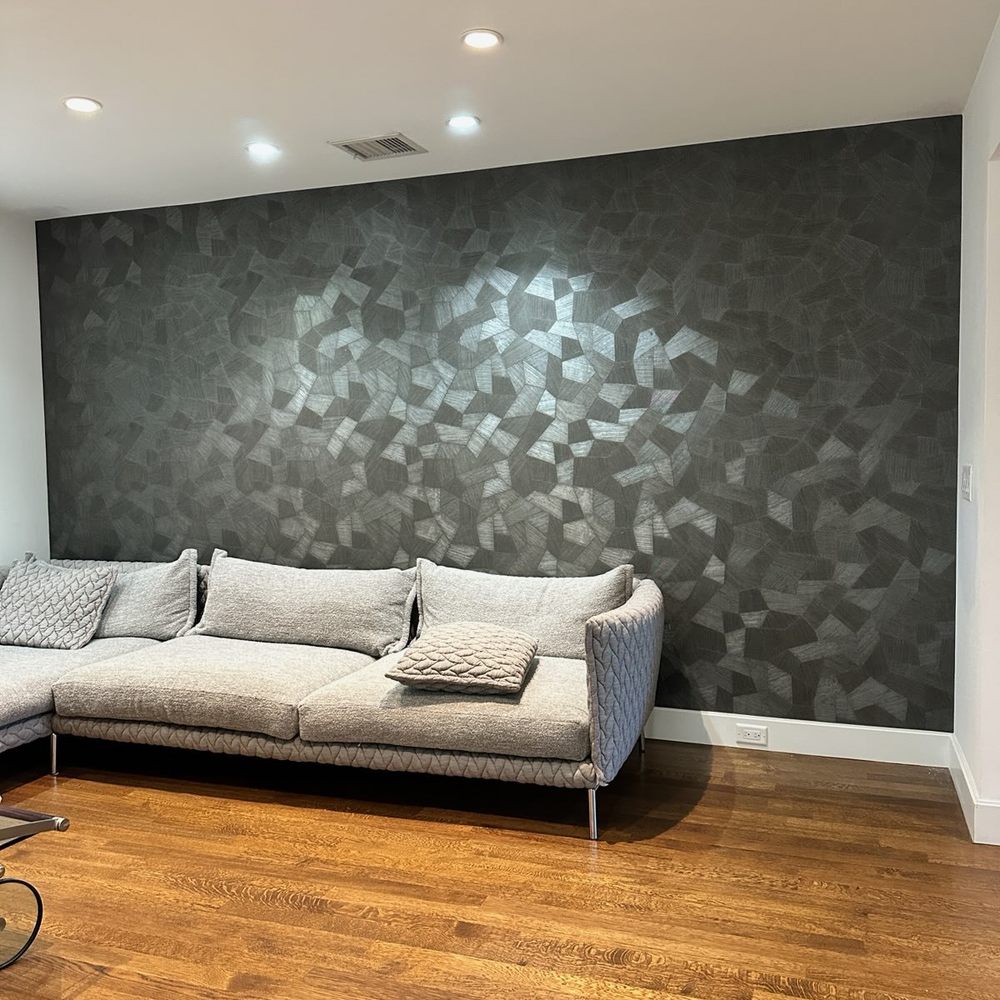 Contemporary room with a professionally finished patterned feature wall